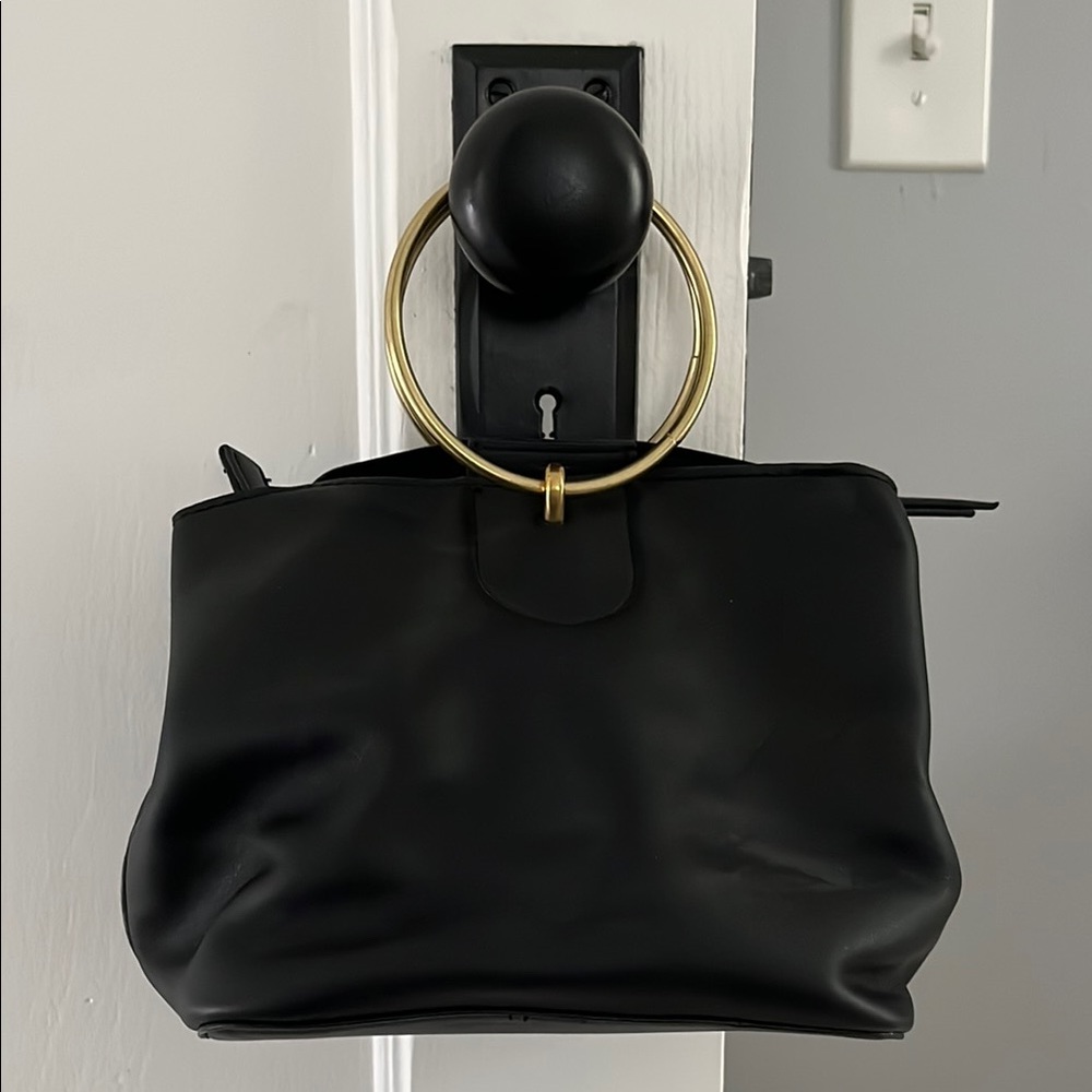 Metal handle handbag